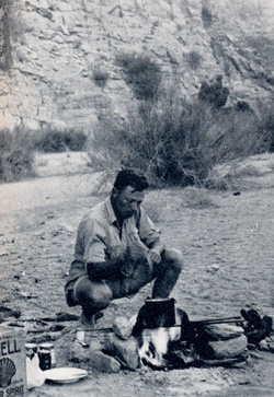 Denis Woods, 1938, preparing a meal at the foot of the Grosse Spitzkuppe. Photo: L J. McDermott