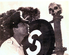 Muti killings in South Africa. A puzzeled constable of the South African Police ponders the origins of the human skull, full of holes and covered in candle wax, which was found on a traffic sign in Claremont. From: Missing & Murdered. A personal adventure in Forensic Anthropologie ISBN 9781770223615 / ISBN 978-1-77022-361-5